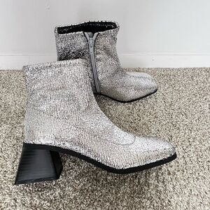 Katy Perry. New without tags. Size 8.5 Metallic Silver Ankle Booties